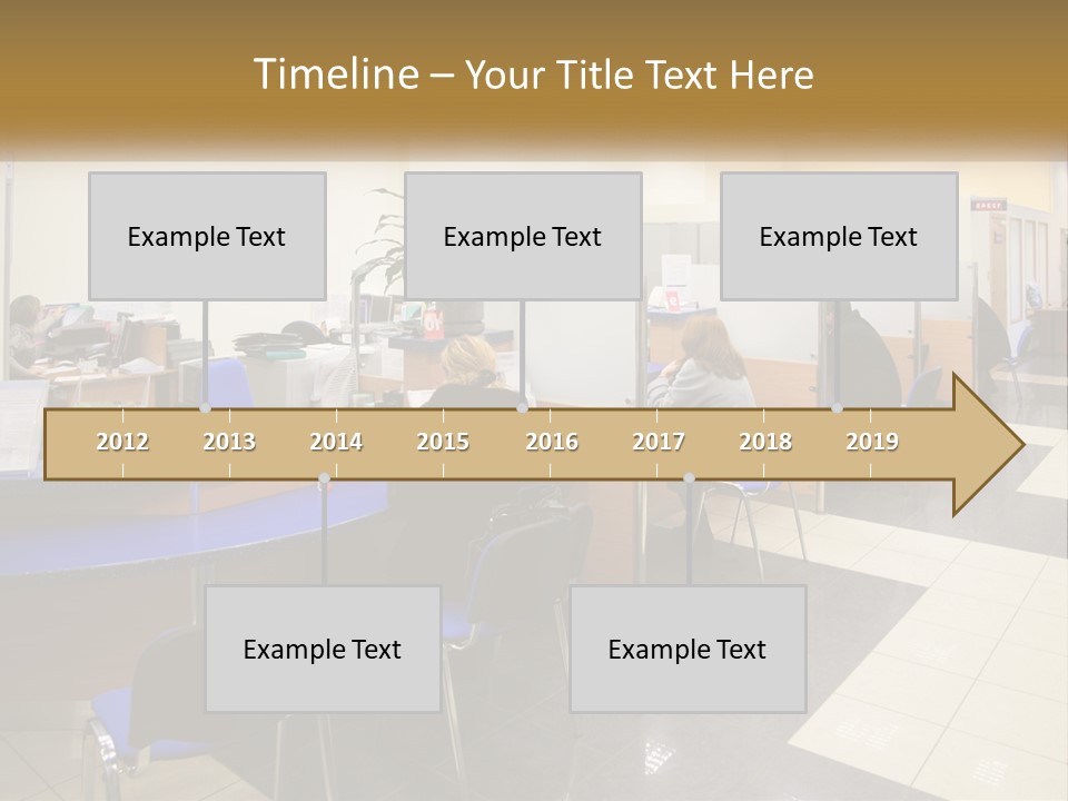 A Group Of People Sitting At Desks In An Office PowerPoint Template