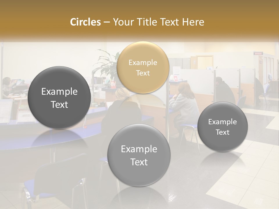 A Group Of People Sitting At Desks In An Office PowerPoint Template