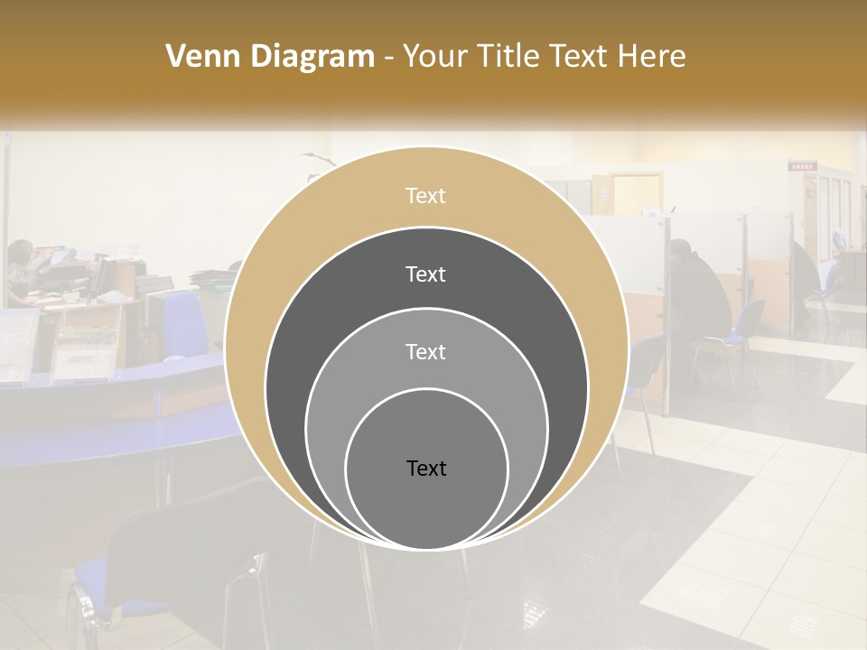 A Group Of People Sitting At Desks In An Office PowerPoint Template