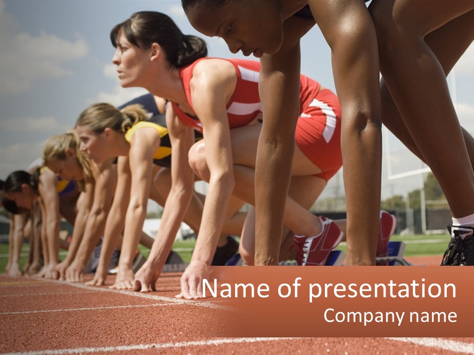 A Group Of Women Lined Up On A Race Track PowerPoint Template
