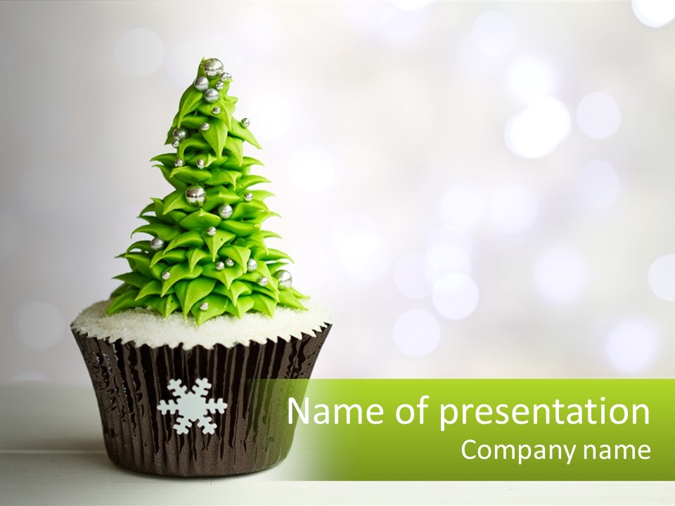 A Cupcake With A Christmas Tree On Top Of It PowerPoint Template