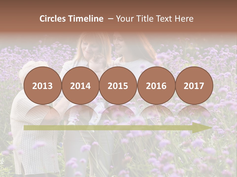 A Group Of Women Holding A Baby In A Field Of Flowers PowerPoint Template