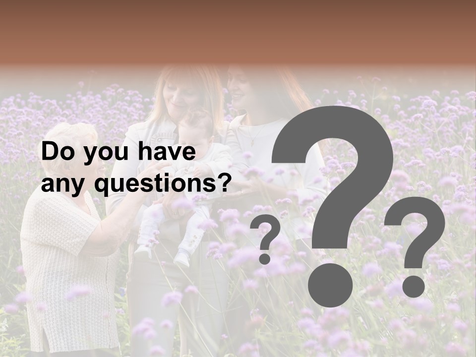 A Group Of Women Holding A Baby In A Field Of Flowers PowerPoint Template