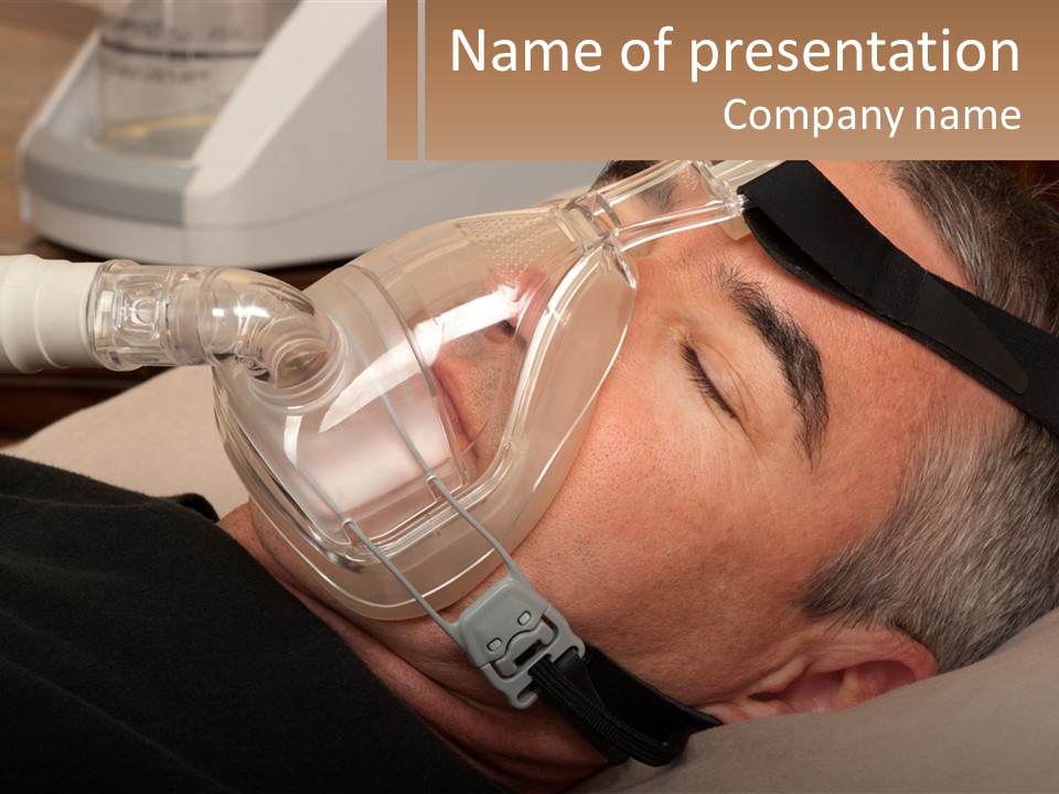 A Man Laying Down With A Breathing Mask On PowerPoint Template
