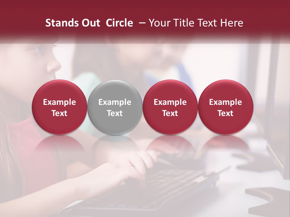 A Group Of Children Sitting At A Computer PowerPoint Template