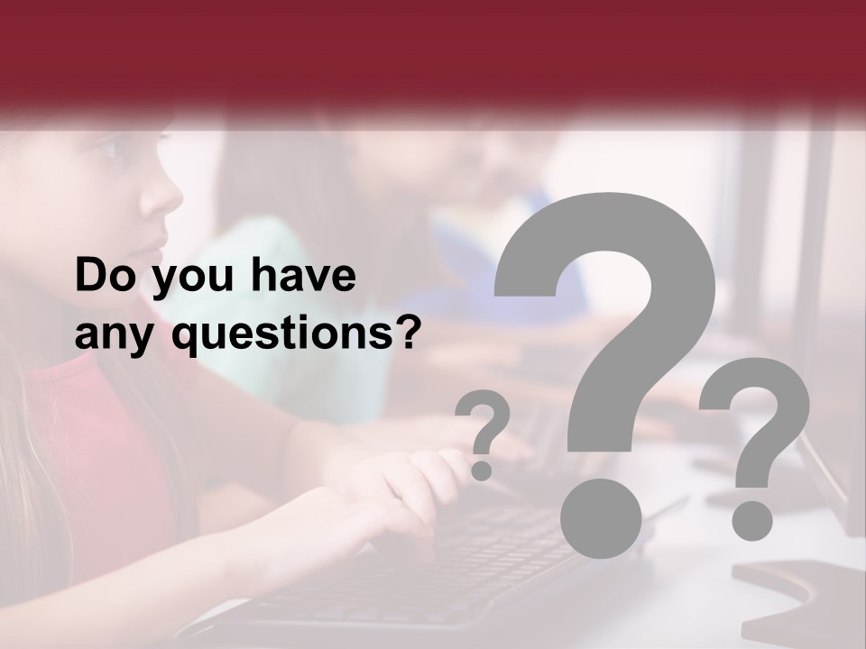 A Group Of Children Sitting At A Computer PowerPoint Template