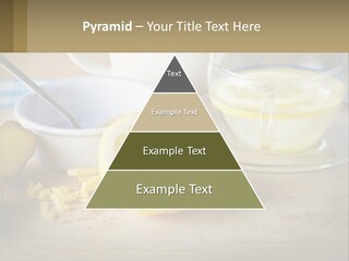 A Table Topped With A Bowl Of Lemons And A Cup Of Tea PowerPoint Template