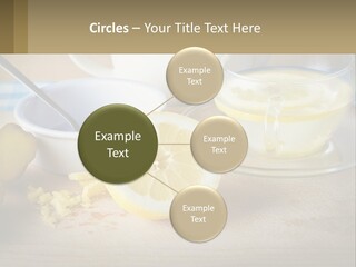 A Table Topped With A Bowl Of Lemons And A Cup Of Tea PowerPoint Template