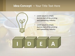 A Table Topped With A Bowl Of Lemons And A Cup Of Tea PowerPoint Template