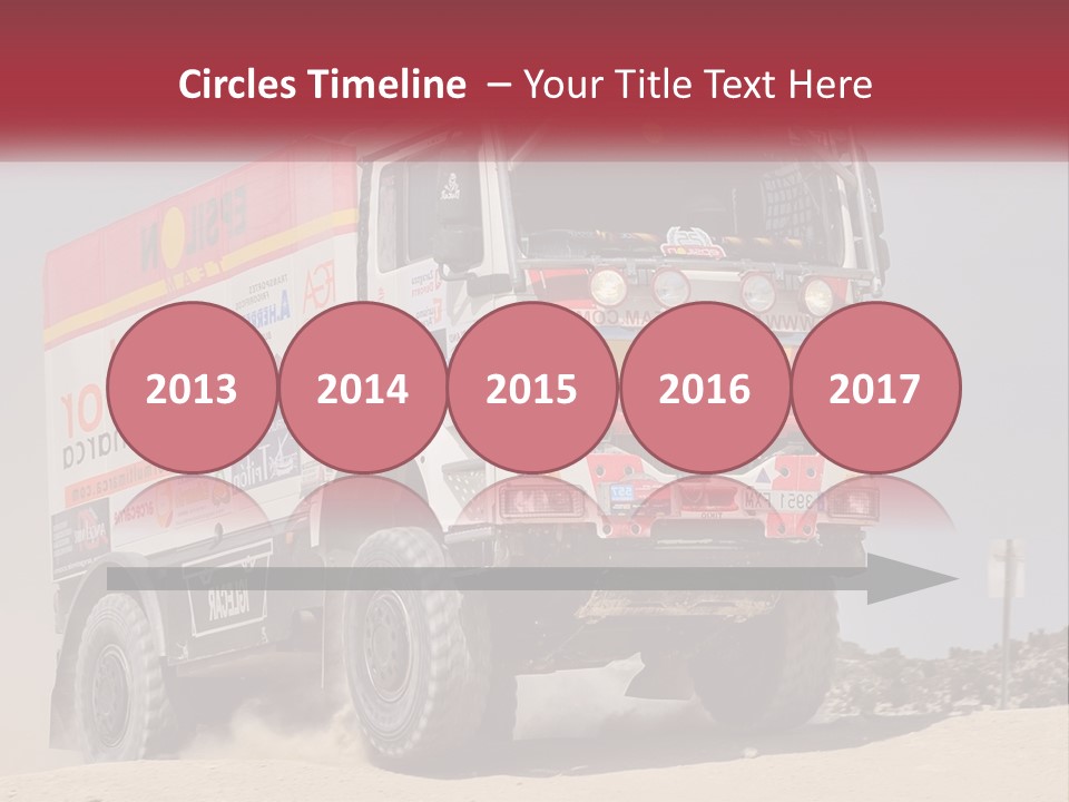 A Large Truck Driving Down A Sandy Road PowerPoint Template
