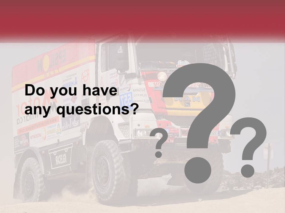 A Large Truck Driving Down A Sandy Road PowerPoint Template