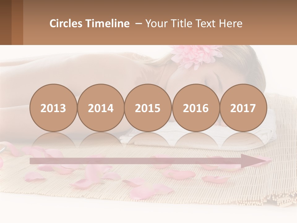 A Woman Laying On Top Of A Towel Next To Pink Petals PowerPoint Template