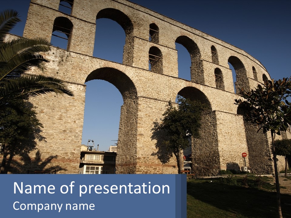 A Large Brick Structure With Arches In The Middle Of It PowerPoint Template