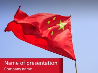A Chinese Flag Flying In The Wind With A Blue Sky In The Background PowerPoint Template