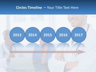 A Doctor Standing In Front Of A Laptop Computer PowerPoint Template