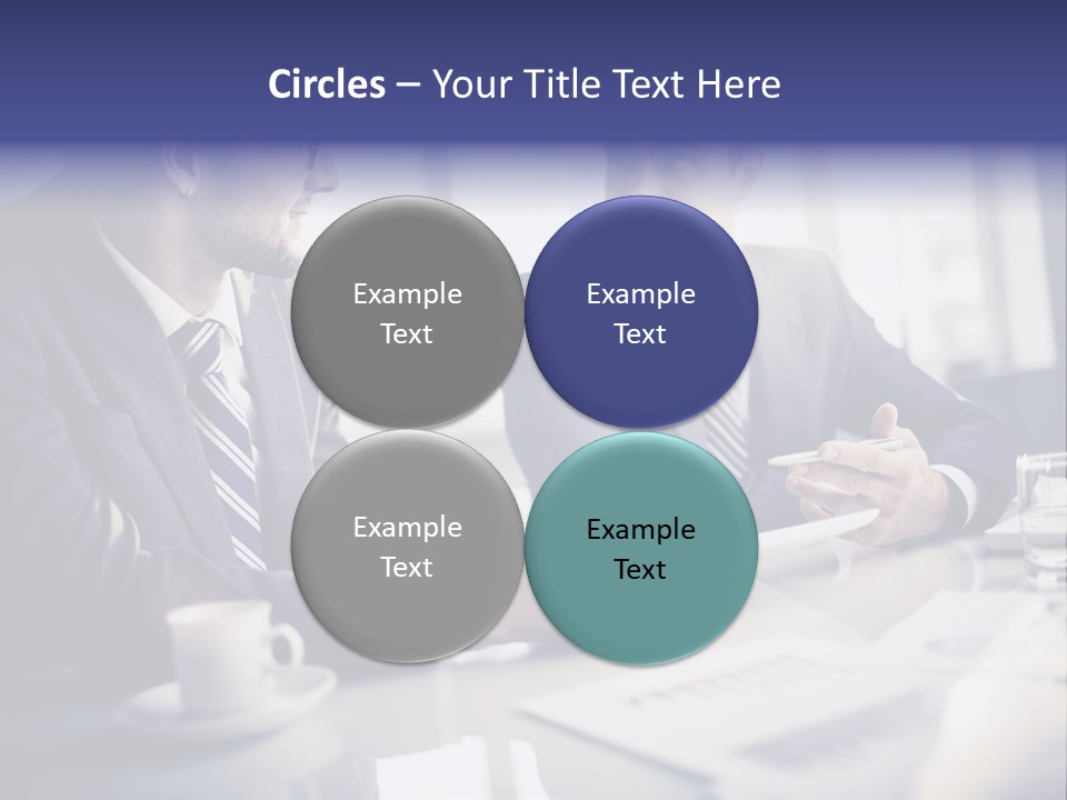 Two Men In Business Suits Sitting At A Table PowerPoint Template