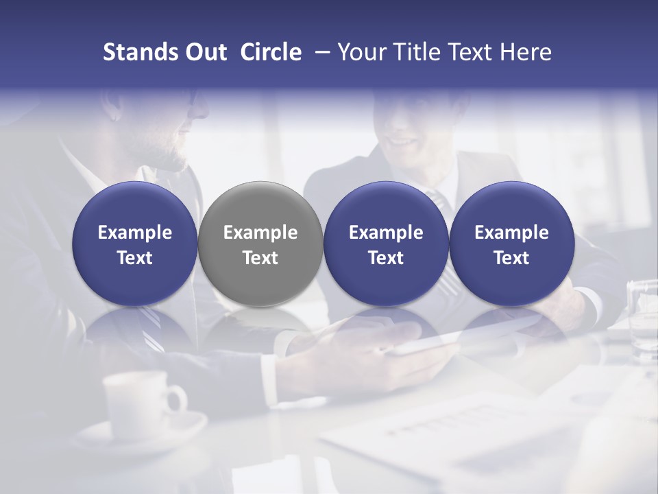 Two Men In Business Suits Sitting At A Table PowerPoint Template