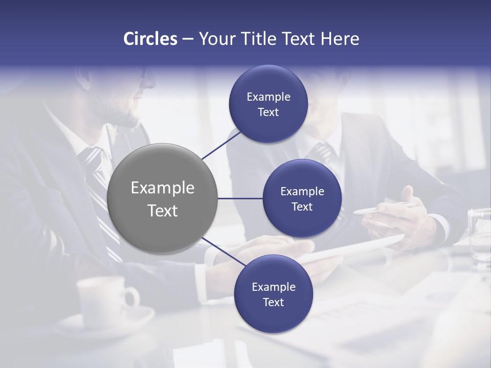 Two Men In Business Suits Sitting At A Table PowerPoint Template