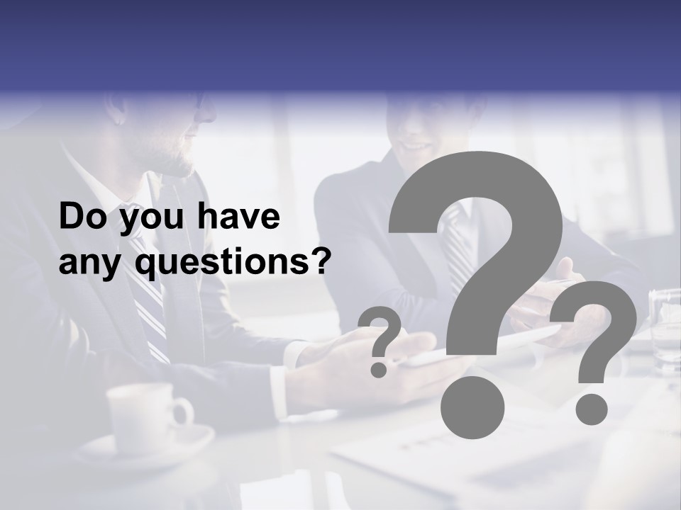 Two Men In Business Suits Sitting At A Table PowerPoint Template