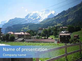 A Picture Of A Town With Mountains In The Background PowerPoint Template