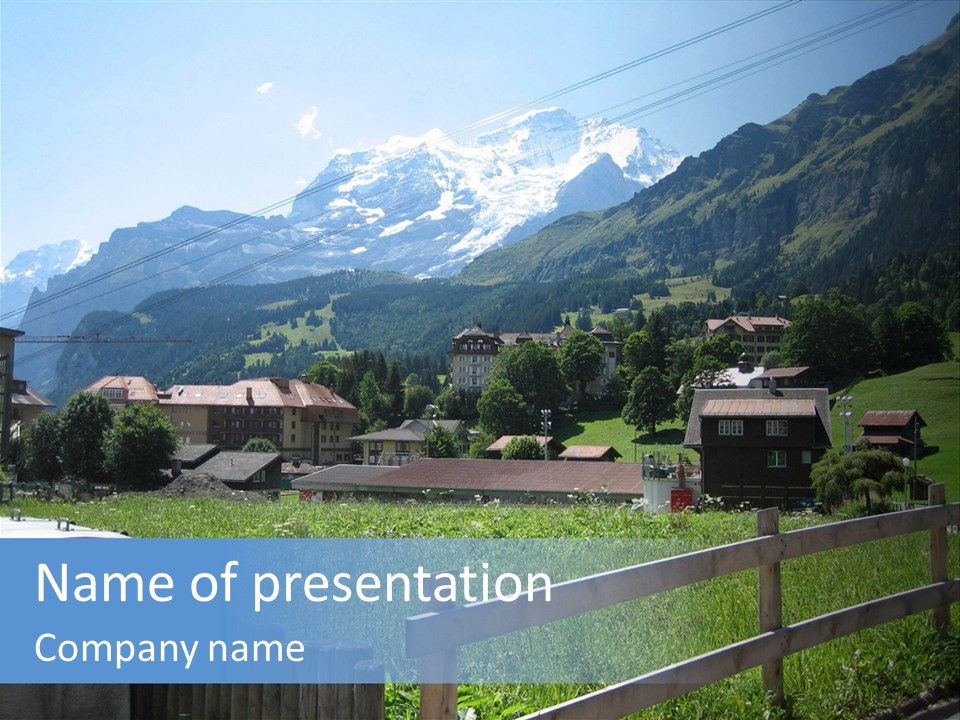 A Picture Of A Town With Mountains In The Background PowerPoint Template