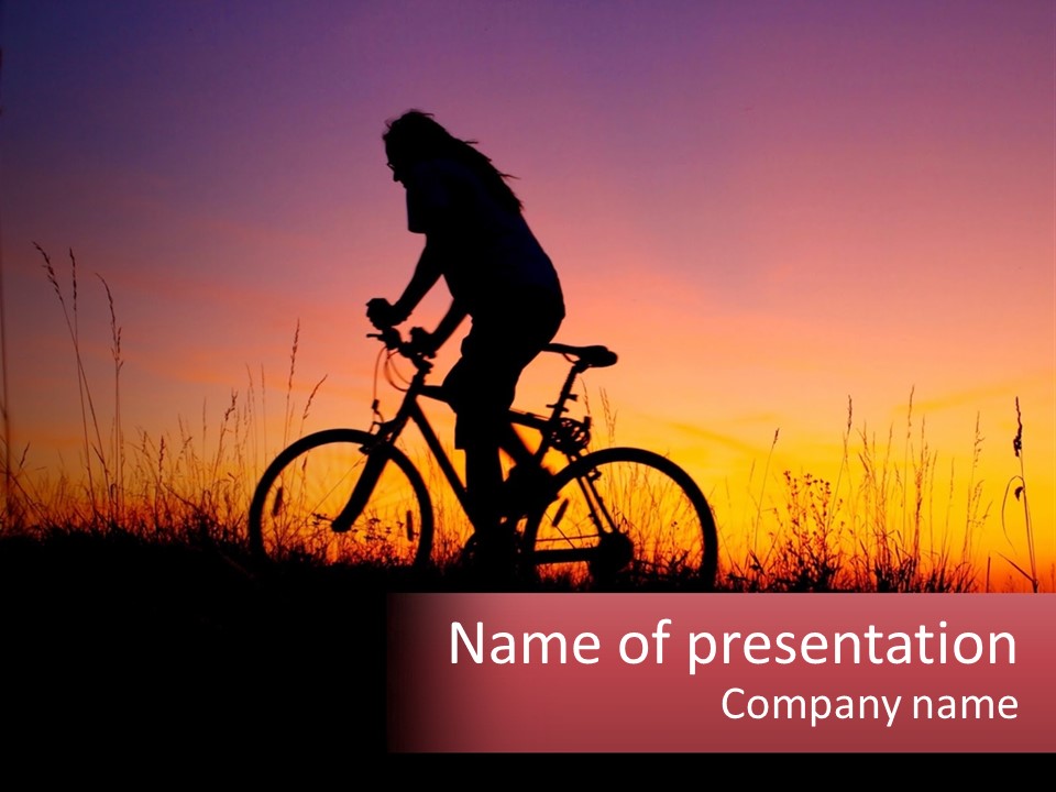A Person Riding A Bike In The Sunset PowerPoint Template
