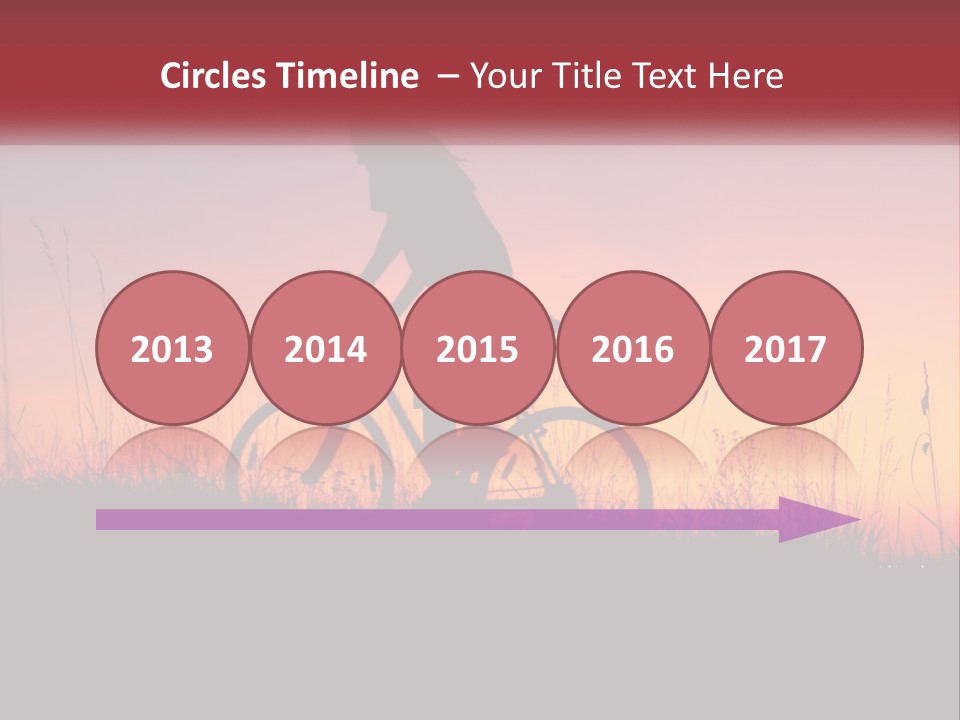 A Person Riding A Bike In The Sunset PowerPoint Template