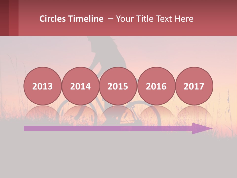 A Person Riding A Bike At Sunset Powerpoint Template PowerPoint Template