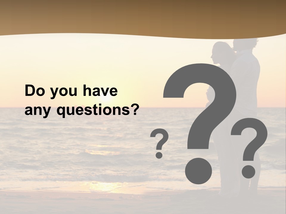 Two People Standing On A Beach At Sunset PowerPoint Template
