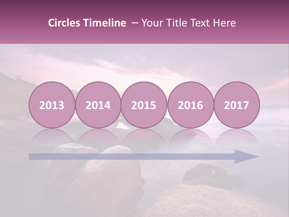 A Rocky Beach With Rocks In The Water PowerPoint Template