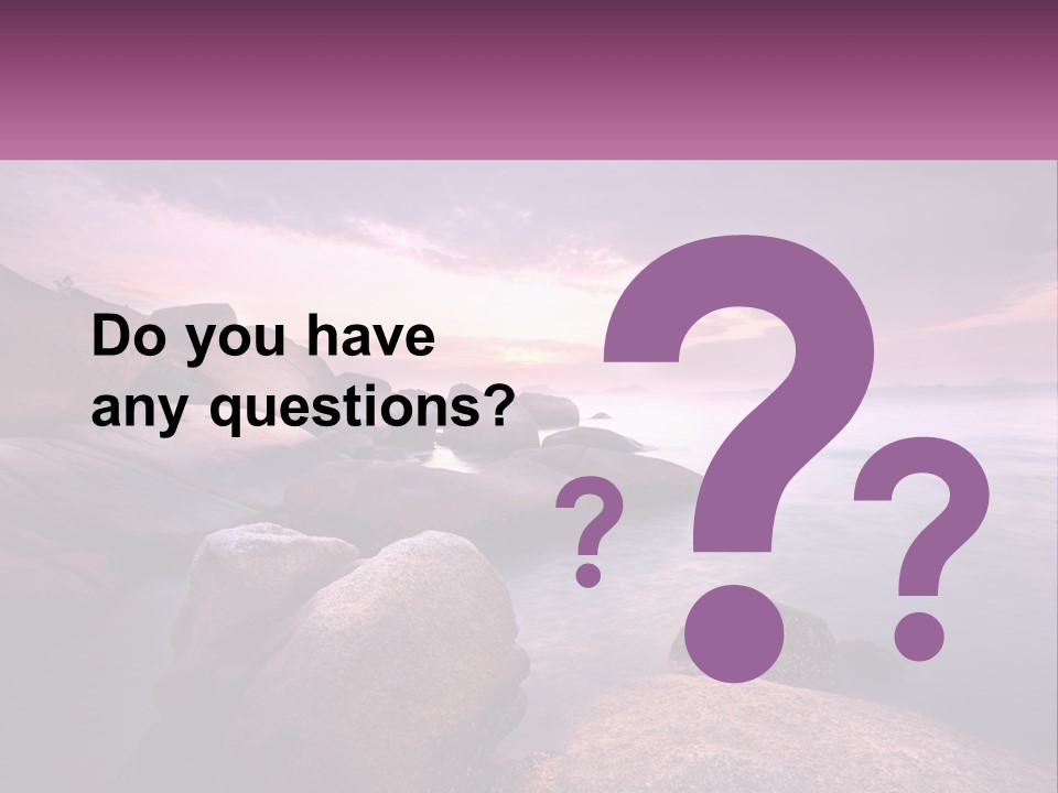 A Rocky Beach With Rocks In The Water PowerPoint Template