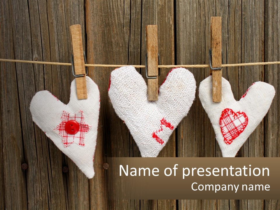 Three Hearts Hanging On A Clothes Line With Clothes Pins PowerPoint Template