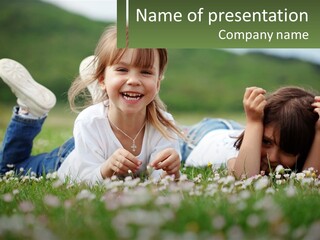 Two Young Girls Laying In The Grass With A Name Plate PowerPoint Template