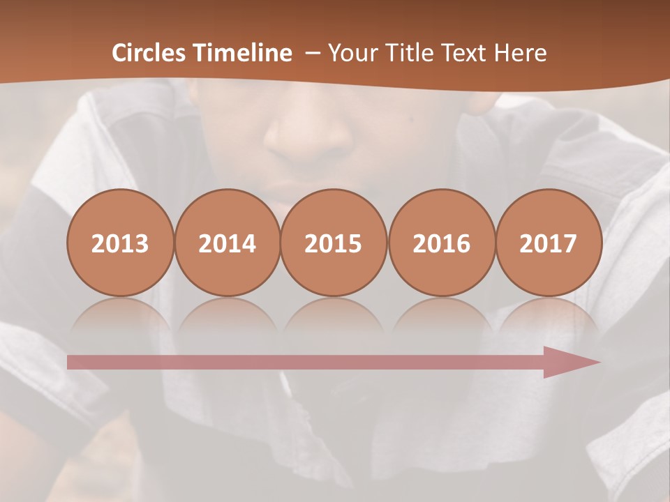 A Young Boy Is Posing For A Picture PowerPoint Template