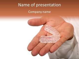 A Person Holding A Plastic Object In Their Hand PowerPoint Template