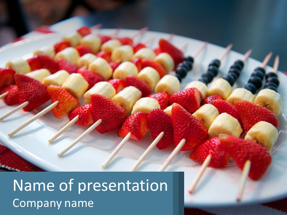 A Plate Of Strawberries And Bananas On Skewers PowerPoint Template