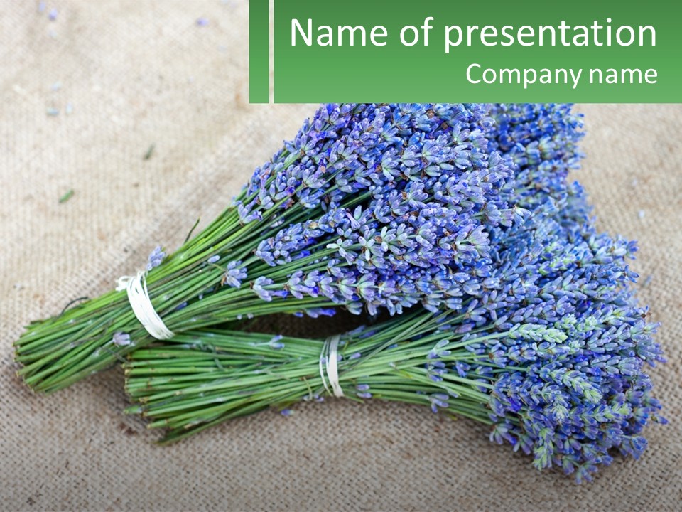 A Bunch Of Lavender Flowers Sitting On Top Of A Table PowerPoint Template