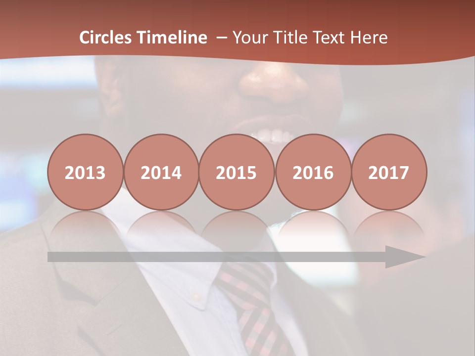 A Man In A Suit And Tie Is Smiling PowerPoint Template