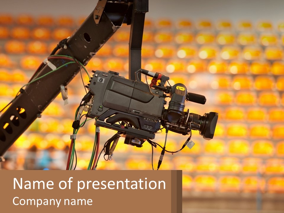 A Camera Attached To A Tripod In Front Of A Wall Of Oranges PowerPoint Template