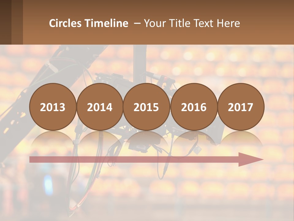 A Camera Attached To A Tripod In Front Of A Wall Of Oranges PowerPoint Template