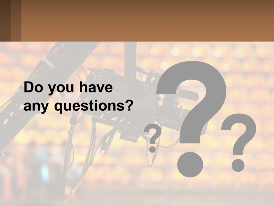 A Camera Attached To A Tripod In Front Of A Wall Of Oranges PowerPoint Template