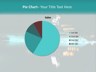 A Large White Boat In The Water At Night PowerPoint Template
