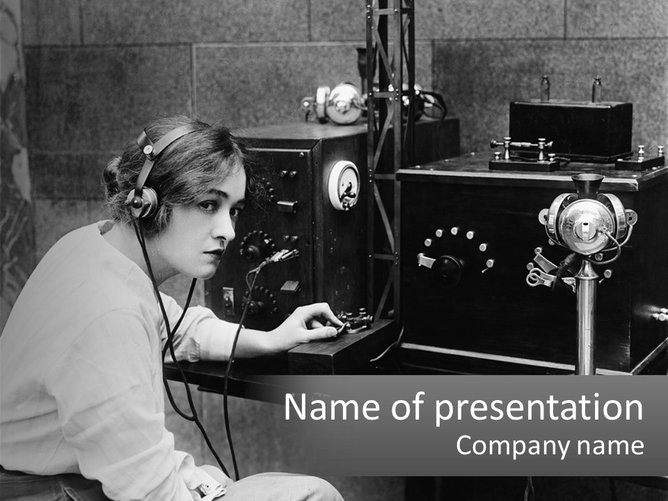 A Woman With Headphones Sitting In Front Of A Radio PowerPoint Template
