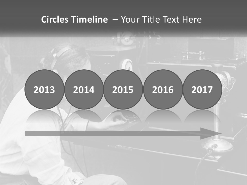 A Woman With Headphones Sitting In Front Of A Radio PowerPoint Template