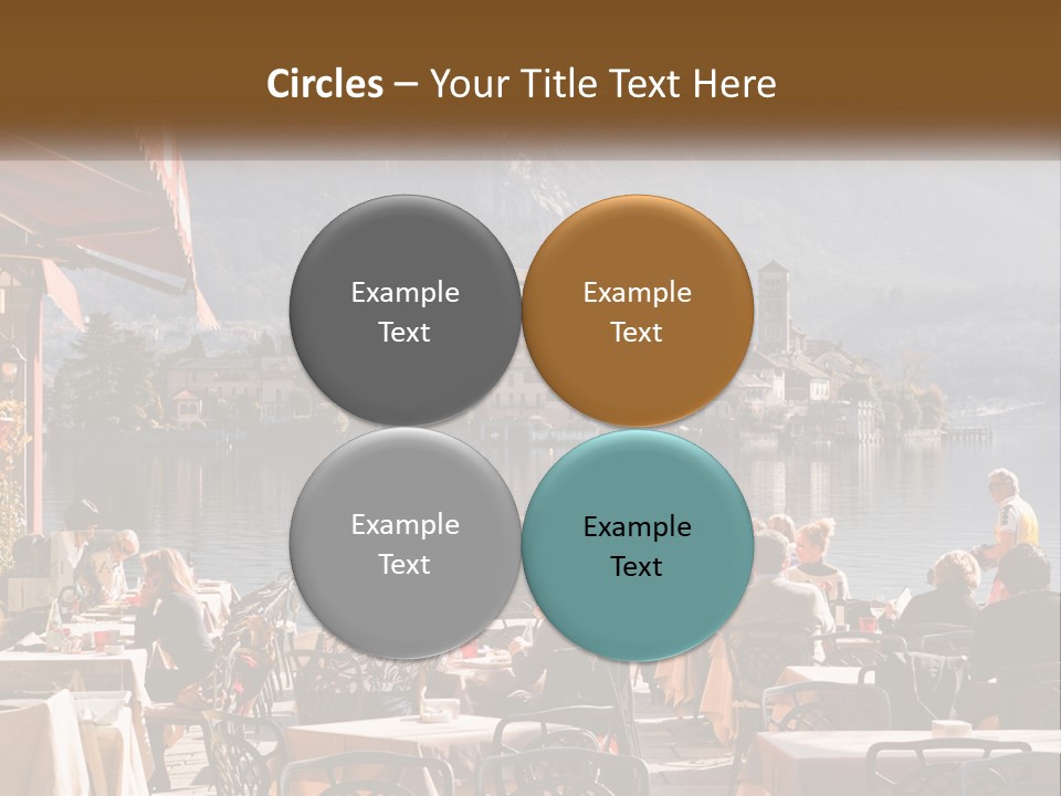 A Group Of People Sitting At A Table In Front Of A Lake PowerPoint Template