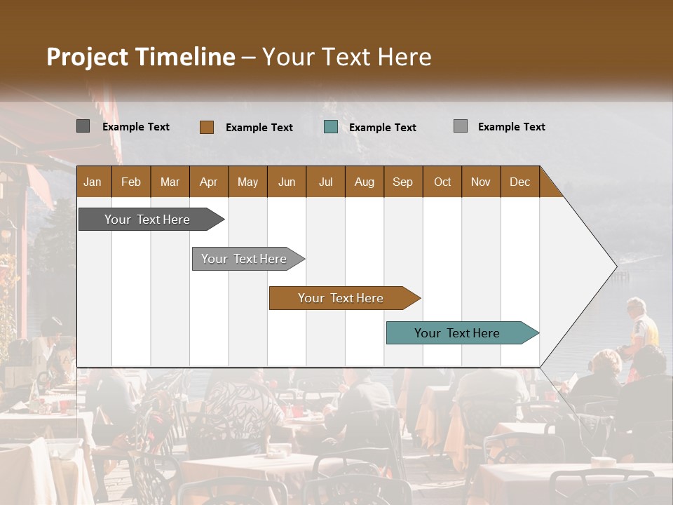 A Group Of People Sitting At A Table In Front Of A Lake PowerPoint Template