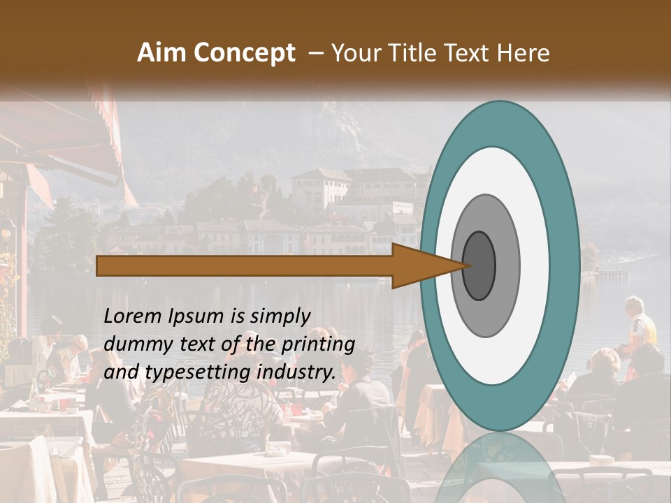 A Group Of People Sitting At A Table In Front Of A Lake PowerPoint Template