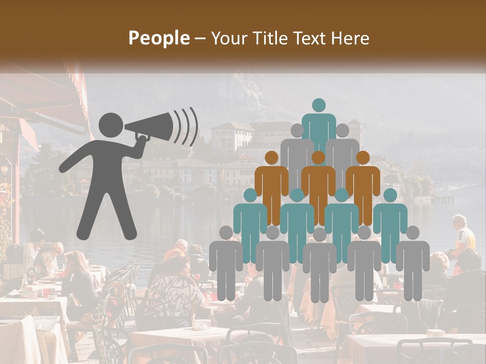 A Group Of People Sitting At A Table In Front Of A Lake PowerPoint Template