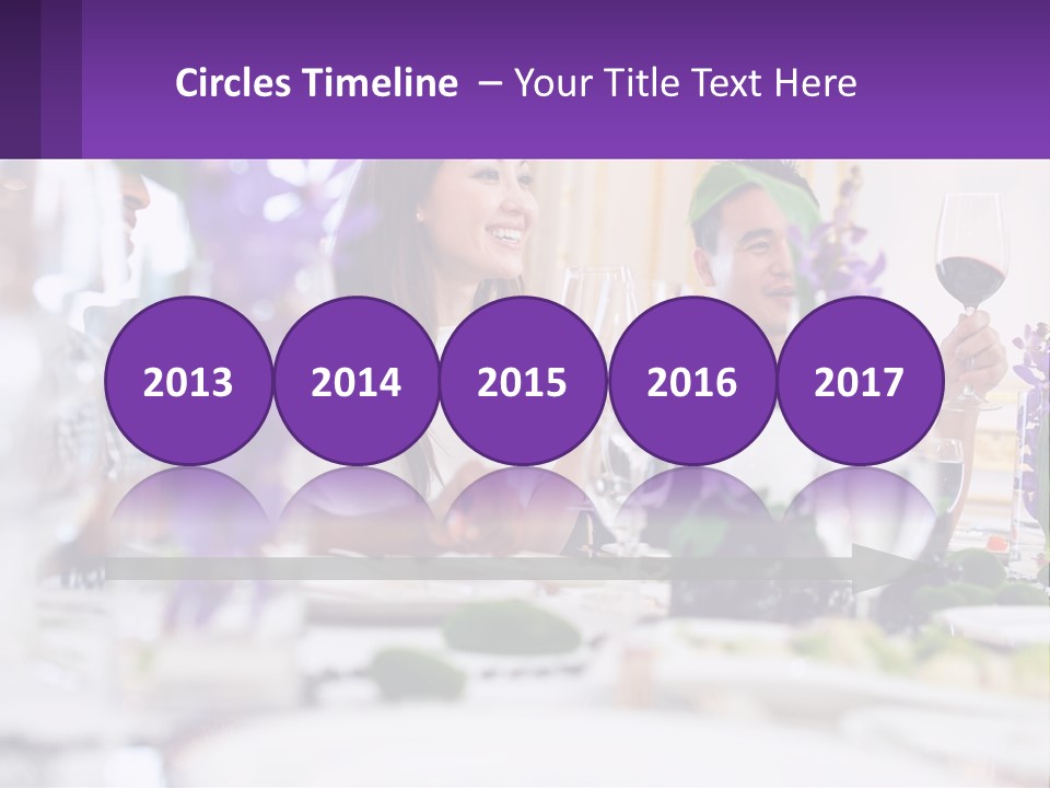 A Group Of People Sitting At A Table With Wine Glasses PowerPoint Template