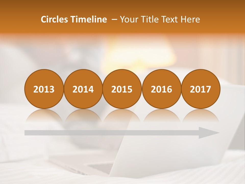 A Man Laying In Bed Next To A Laptop Computer PowerPoint Template